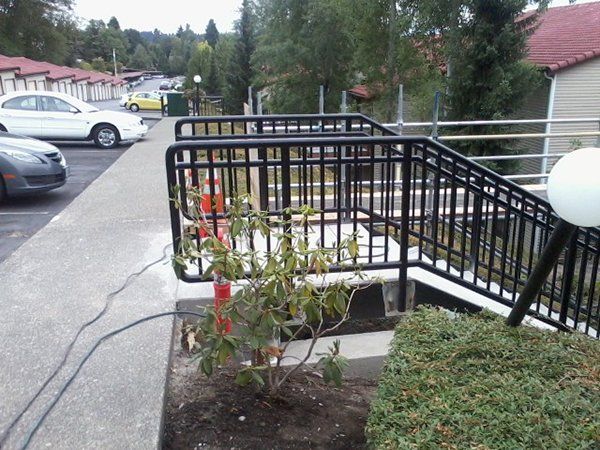 Stairs leading up to a building with a black railing