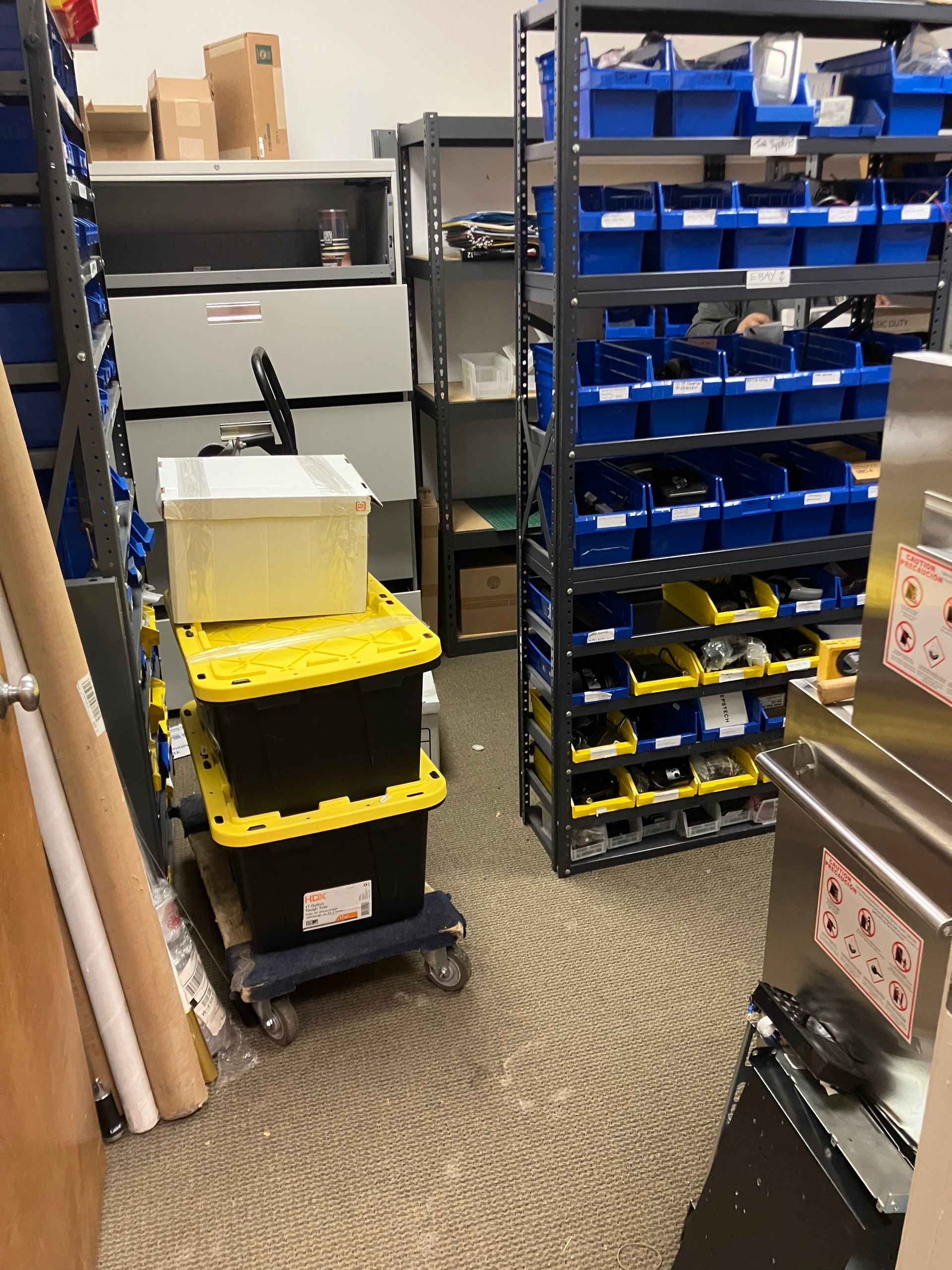 A warehouse filled with lots of shelves and bins
