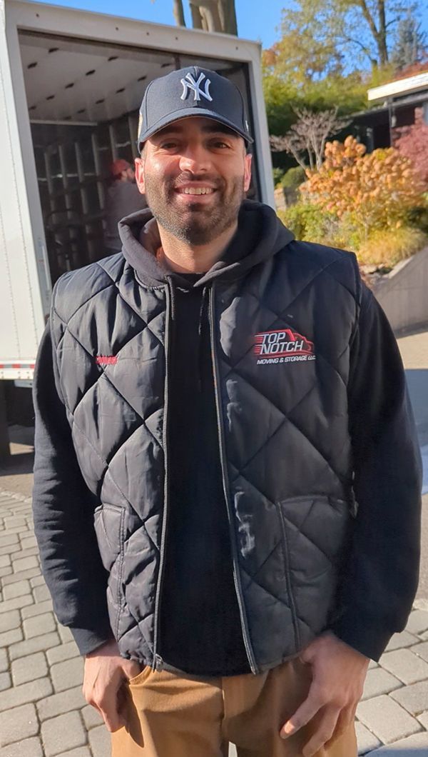 Dave Pinuel in front of a moving truck