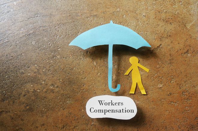 Paper cut-out of person under a blue umbrella labeled