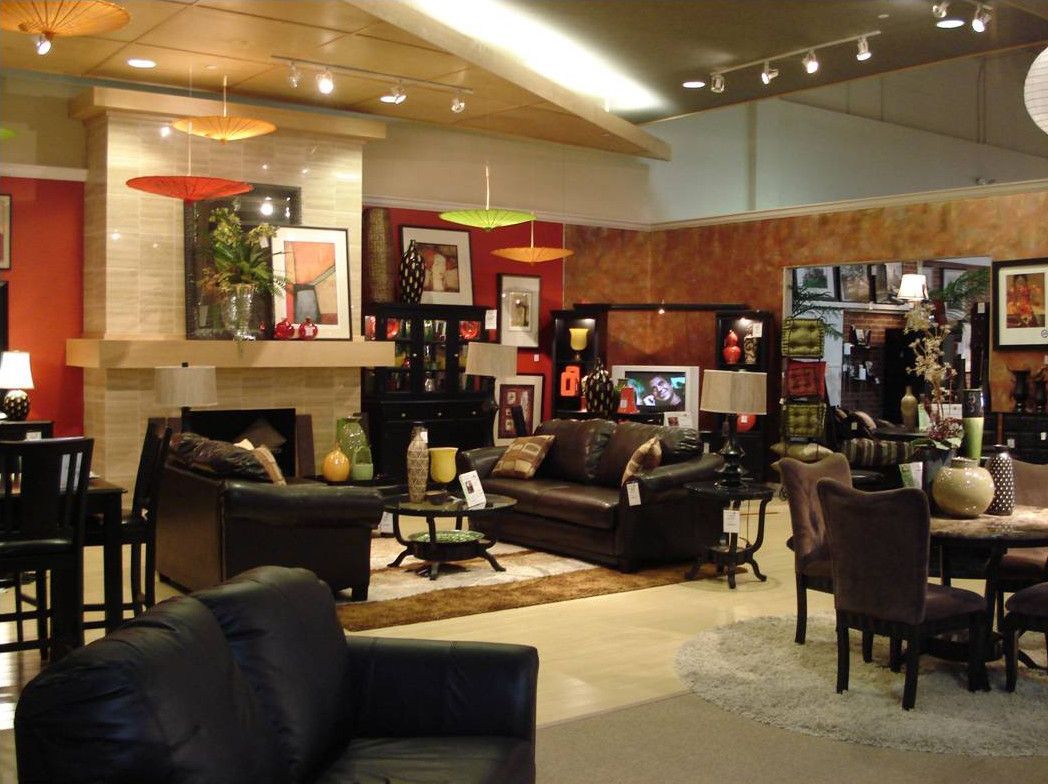 A living room filled with furniture and a fireplace