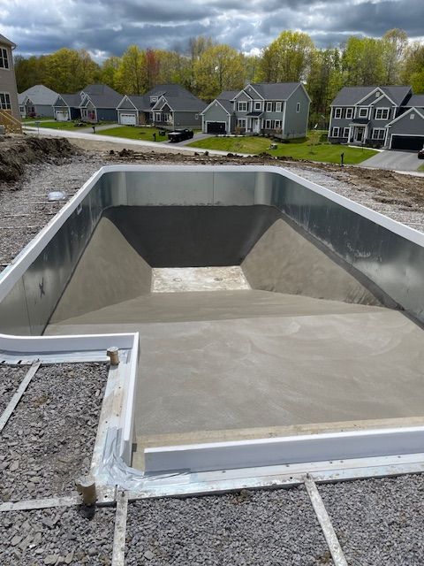 A large swimming pool is being built in a residential area