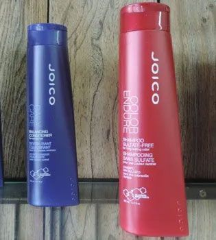 Two Joico shampoo bottles: blue