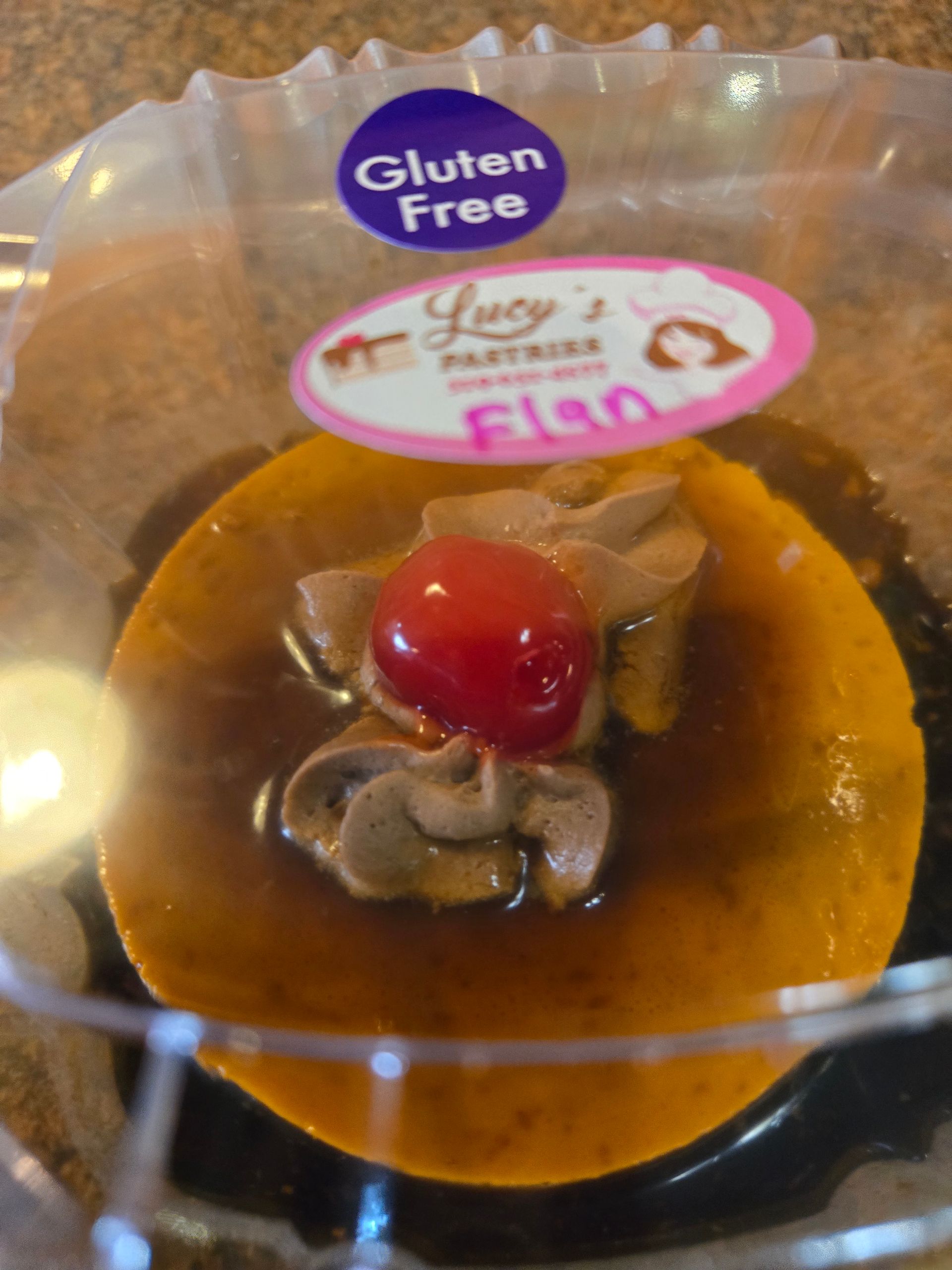 A gluten free flan with a cherry on top