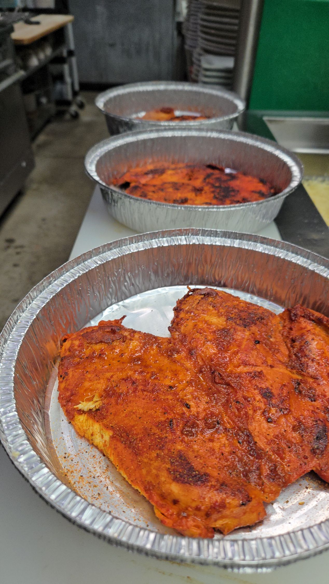 A close up of a plate of food on a table in a kitchen.