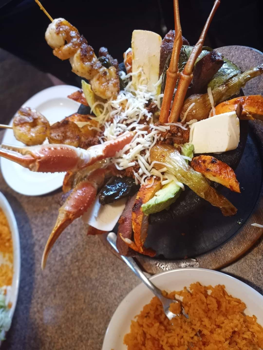 A plate of food with crabs and shrimp on it