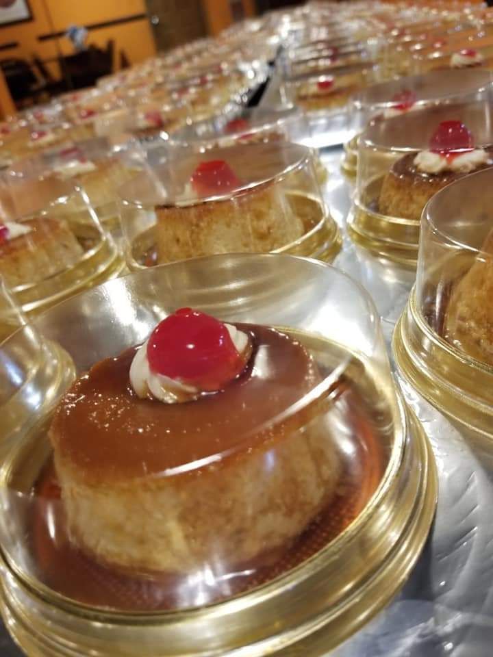 A close up of a dessert with a cherry on top