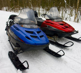 Blue and red snowmobile
