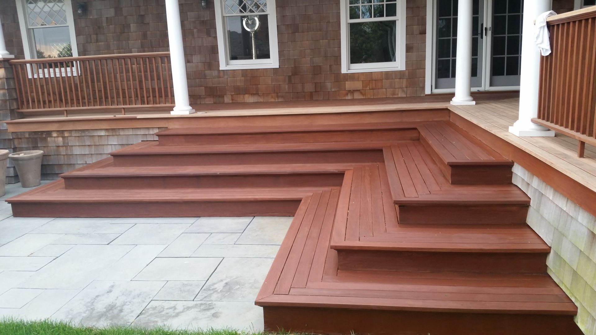 A wooden deck with stairs leading up to it