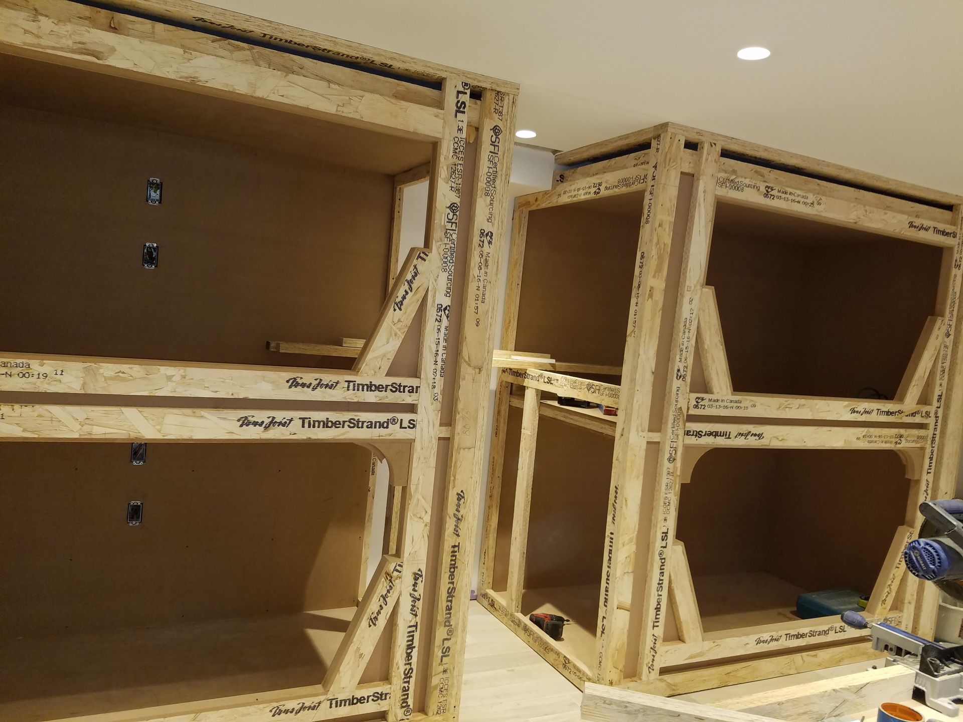 A room with a lot of wooden boxes stacked on top of each other