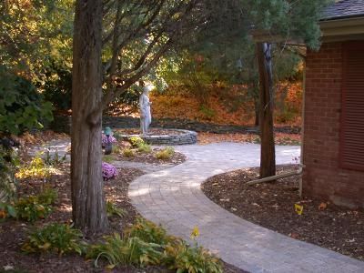 A path leading to a brick building in a park