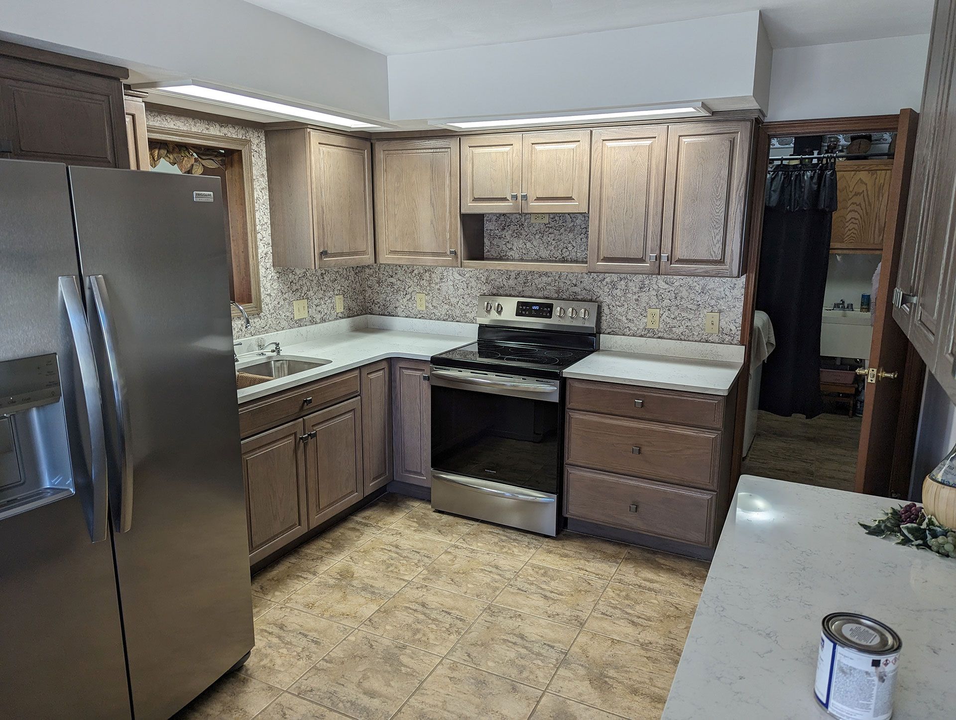 kitchen wooden cabinets with stainless steel appliances
