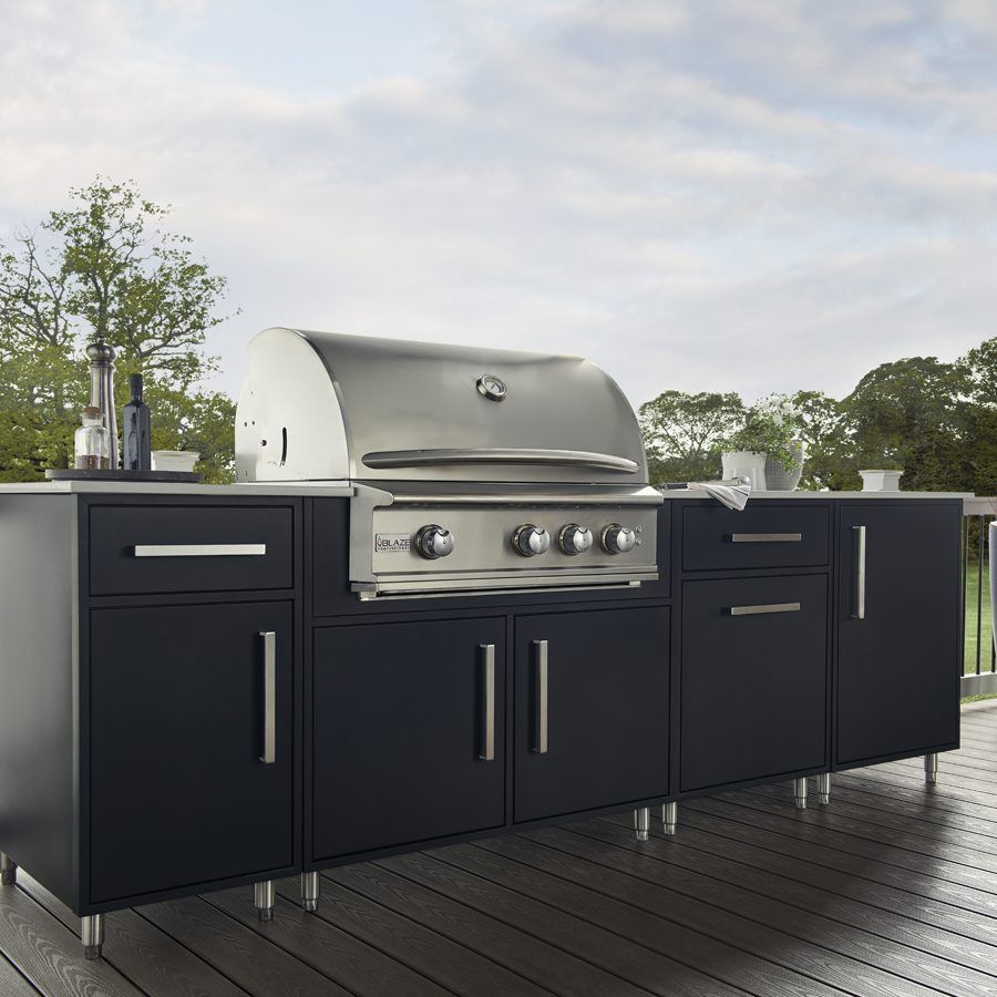 a stainless steel grill is sitting on top of a black cabinet on a deck