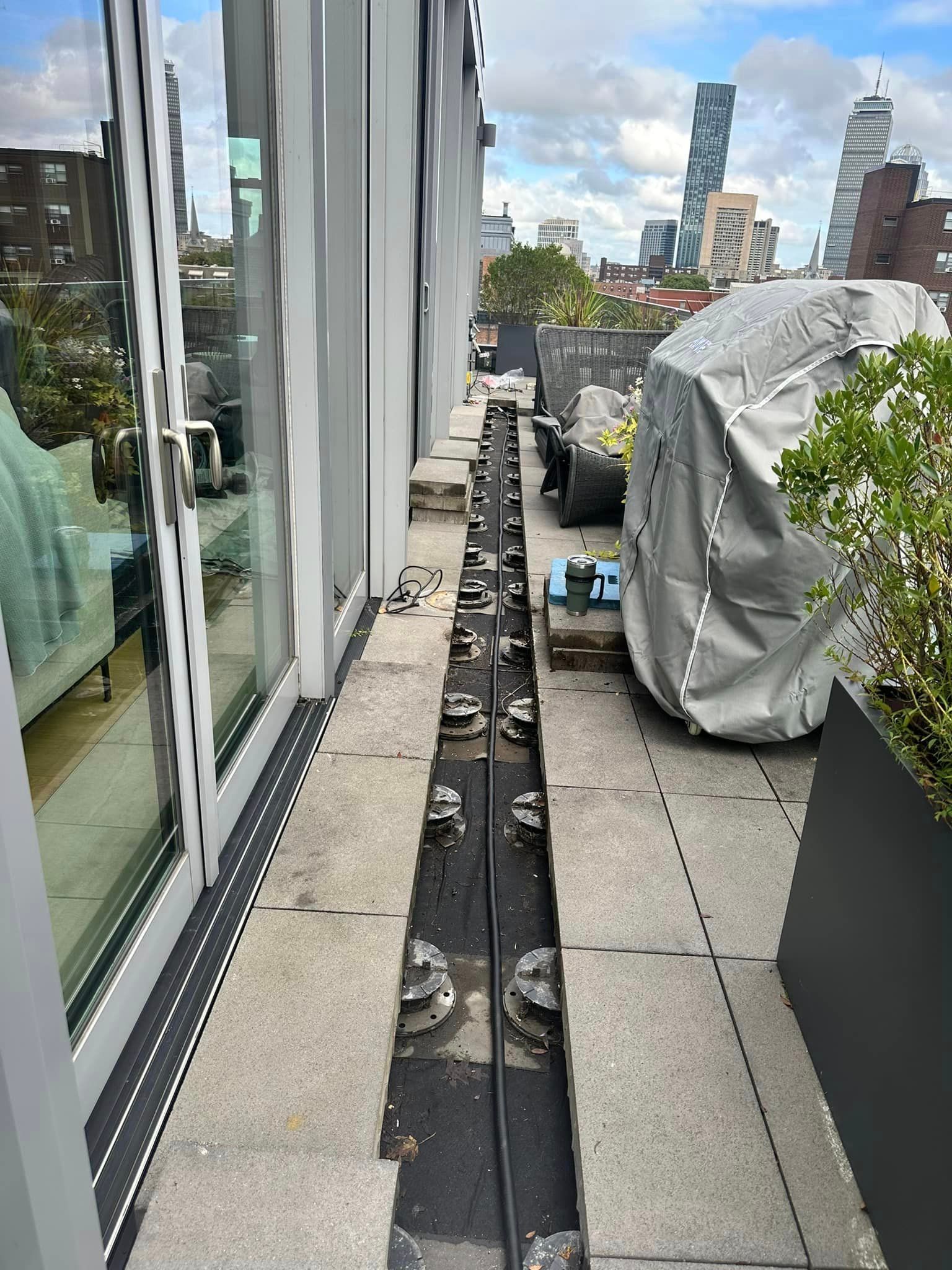 There is a drain on the side of the balcony.