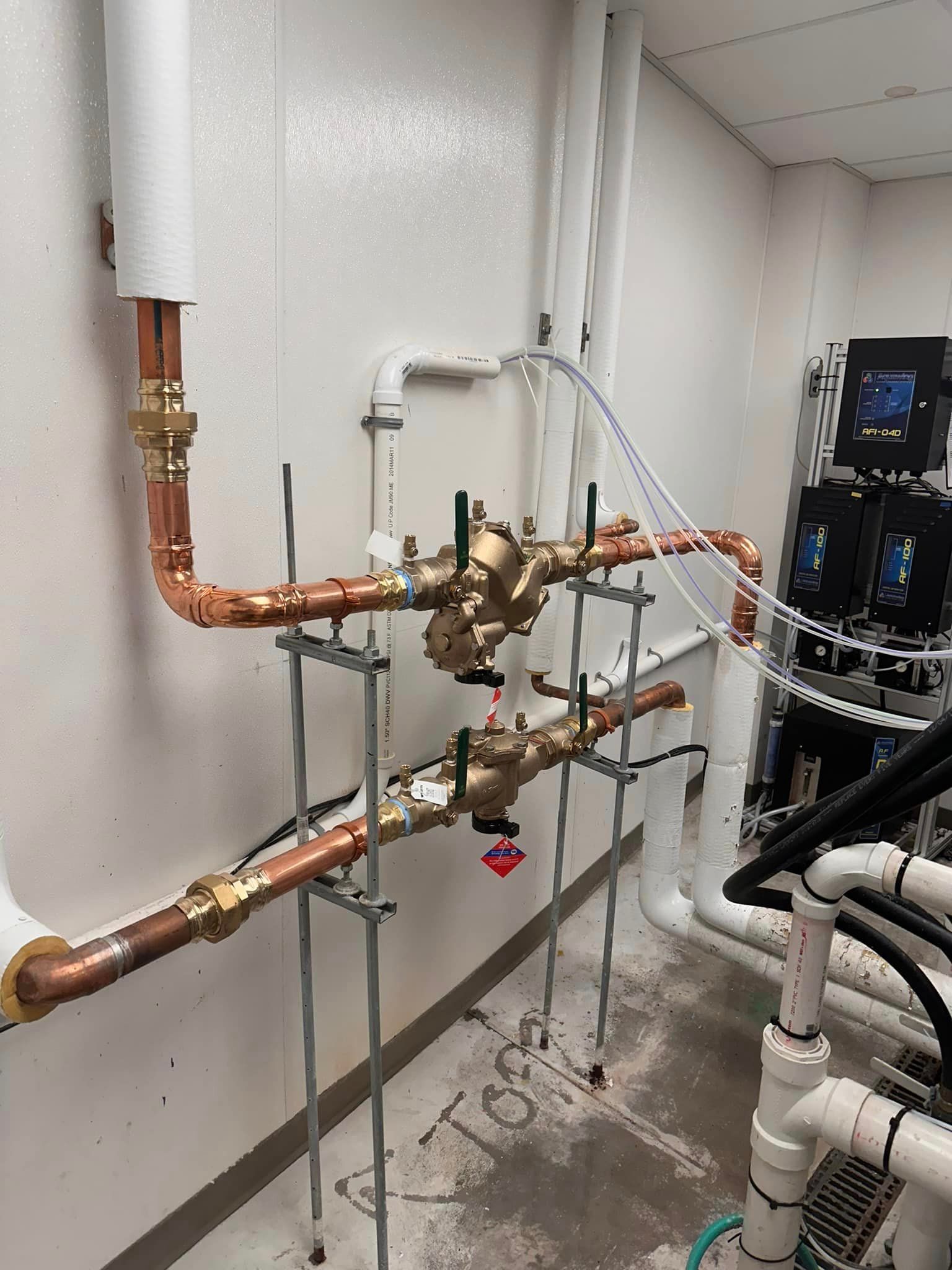 A room filled with lots of pipes and valves.