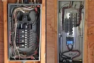 Two open electrical breaker panels with exposed wiring in unfinished wall cavities