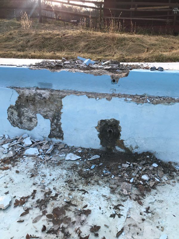 A swimming pool with a hole in the wall