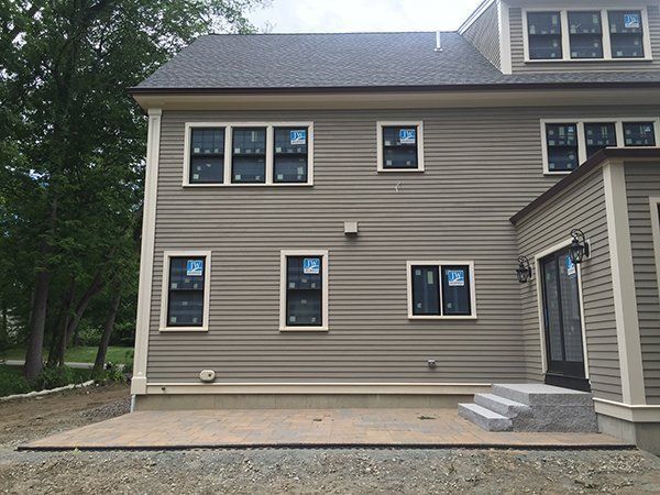 A house with a lot of windows is being built