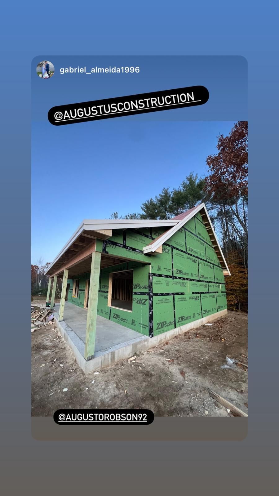 A house is being built with green insulation and a porch.