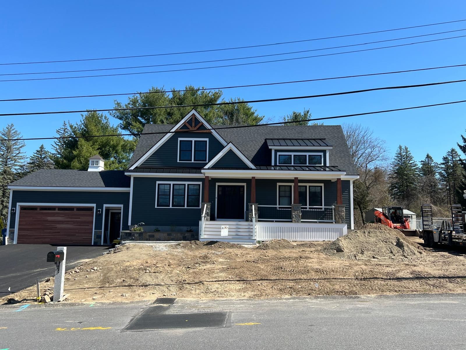 A large house is being built on the side of the road.