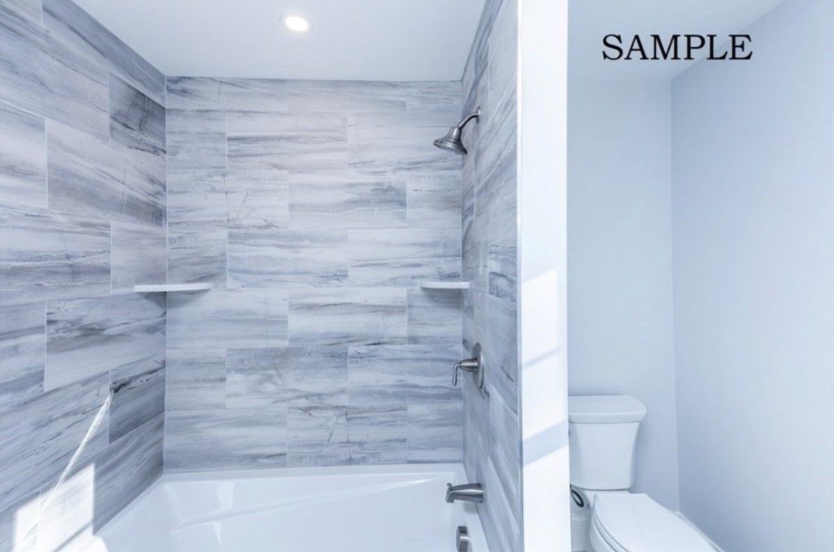 A bathroom with a bathtub, toilet, and shower.