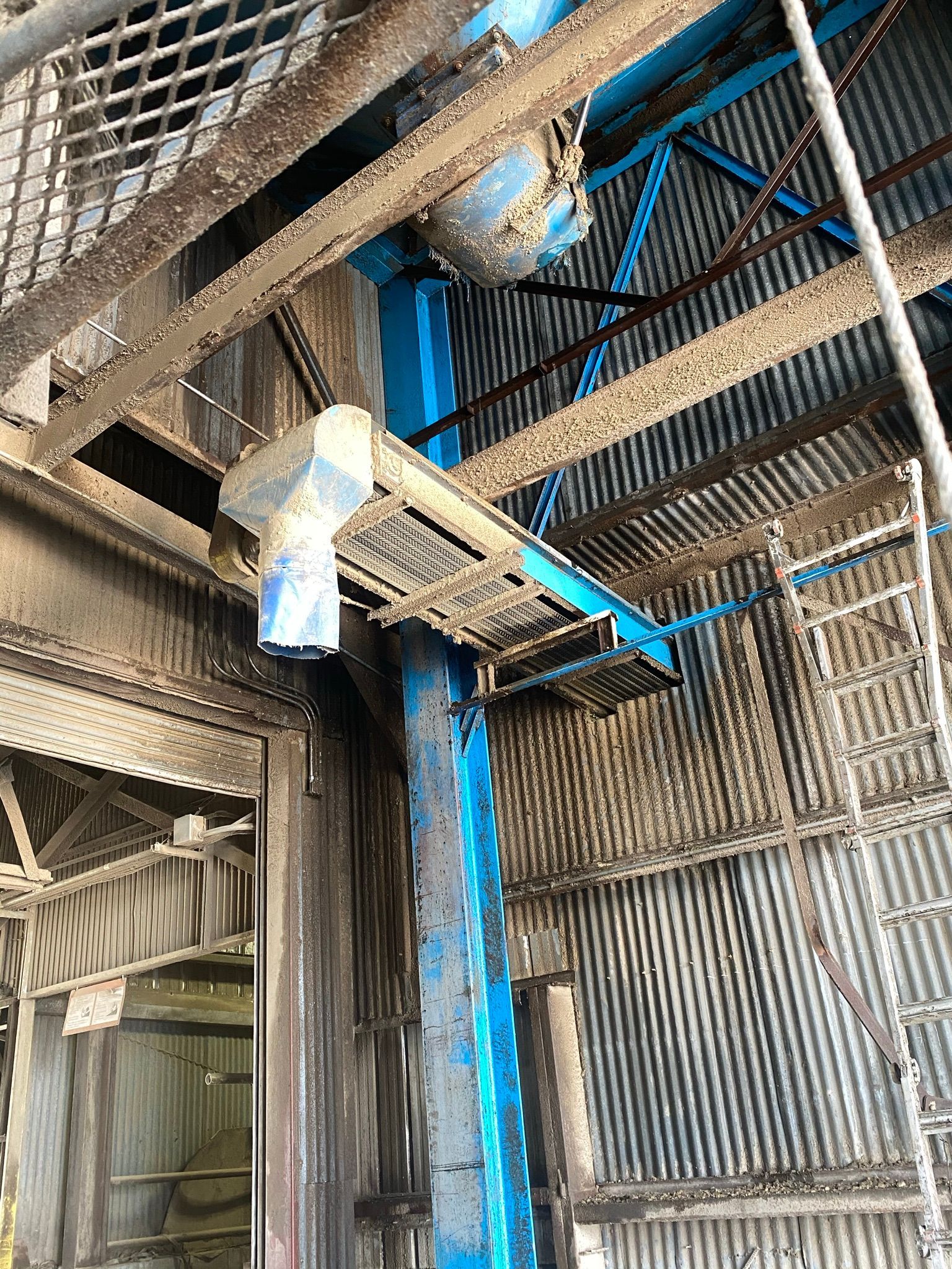 Blue industrial machinery and metal structure.