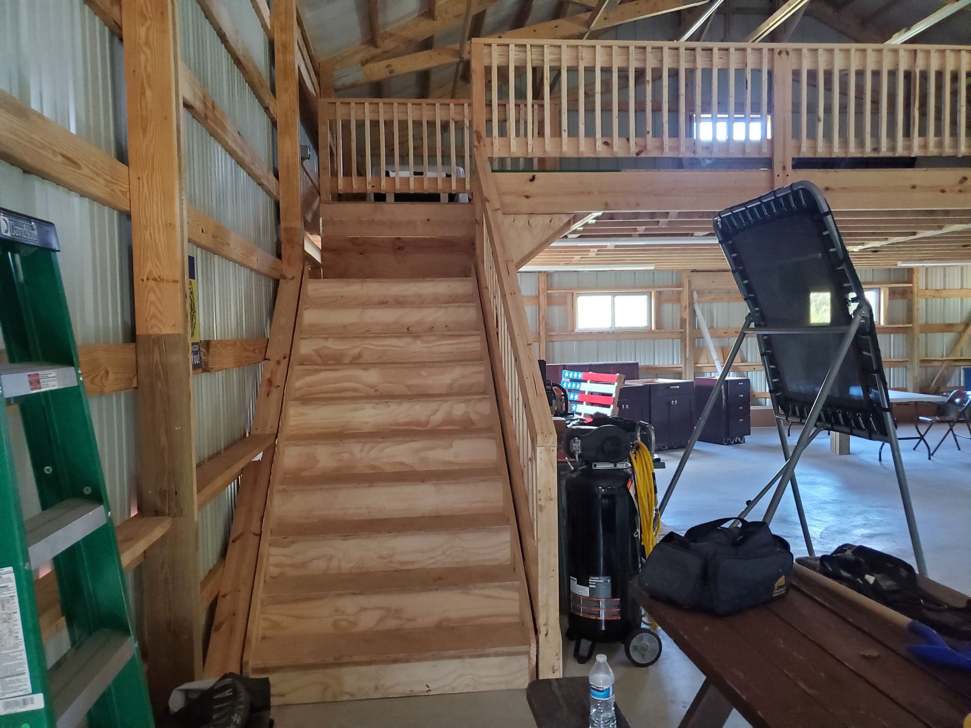 A wooden staircase leading up to the second floor of a building
