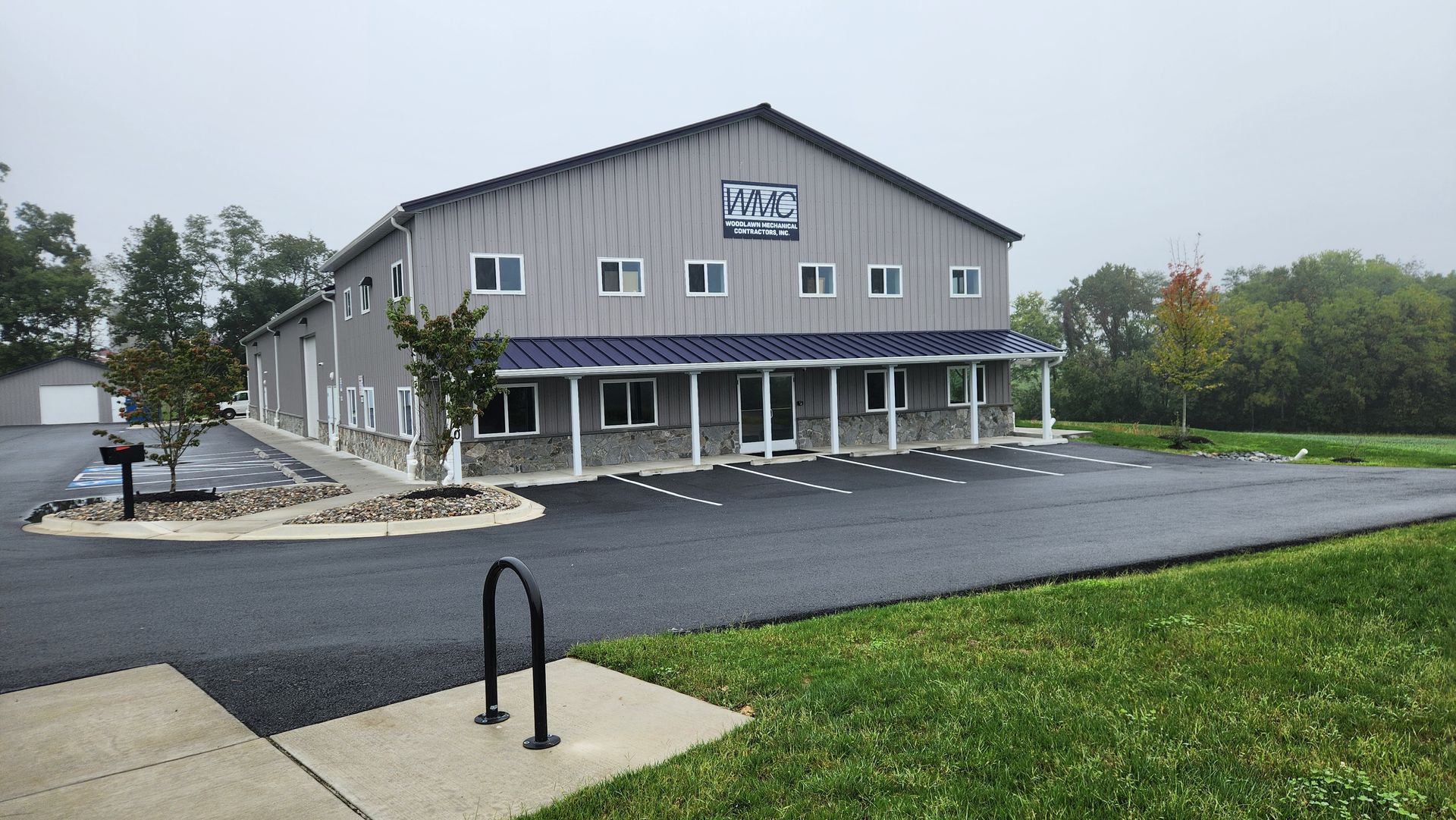 A large building with a lot of windows and a sign that says ' plaza ' on it