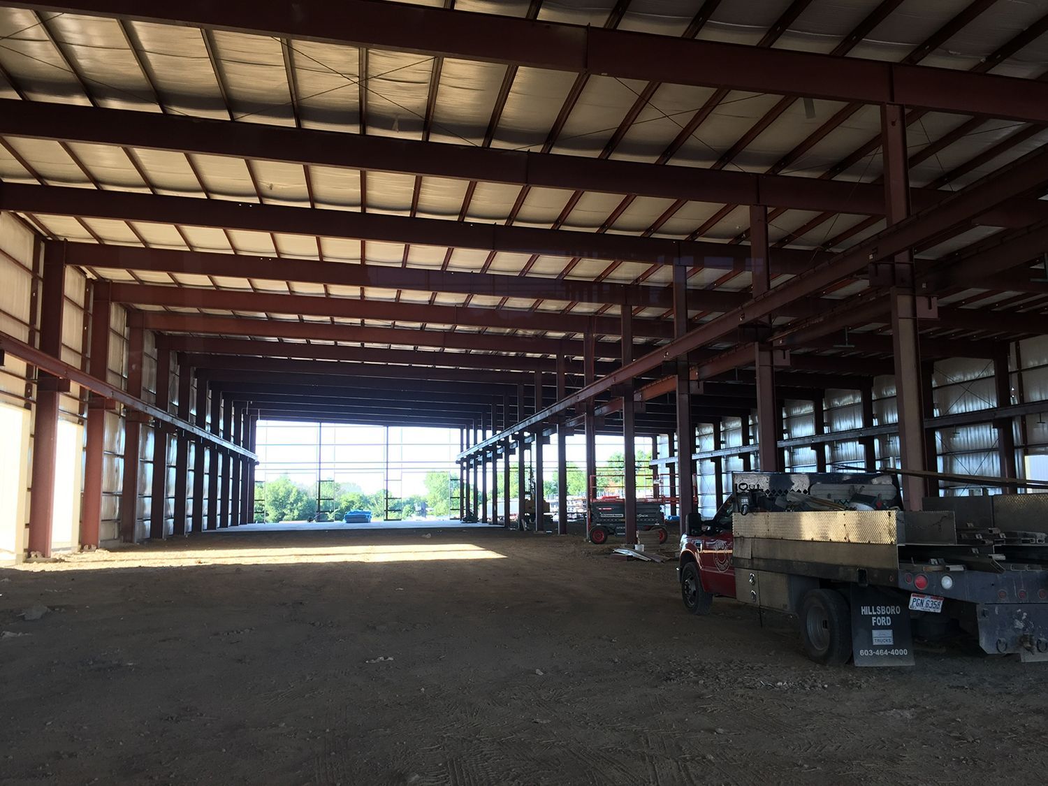 A large warehouse with a lot of machinery inside of it