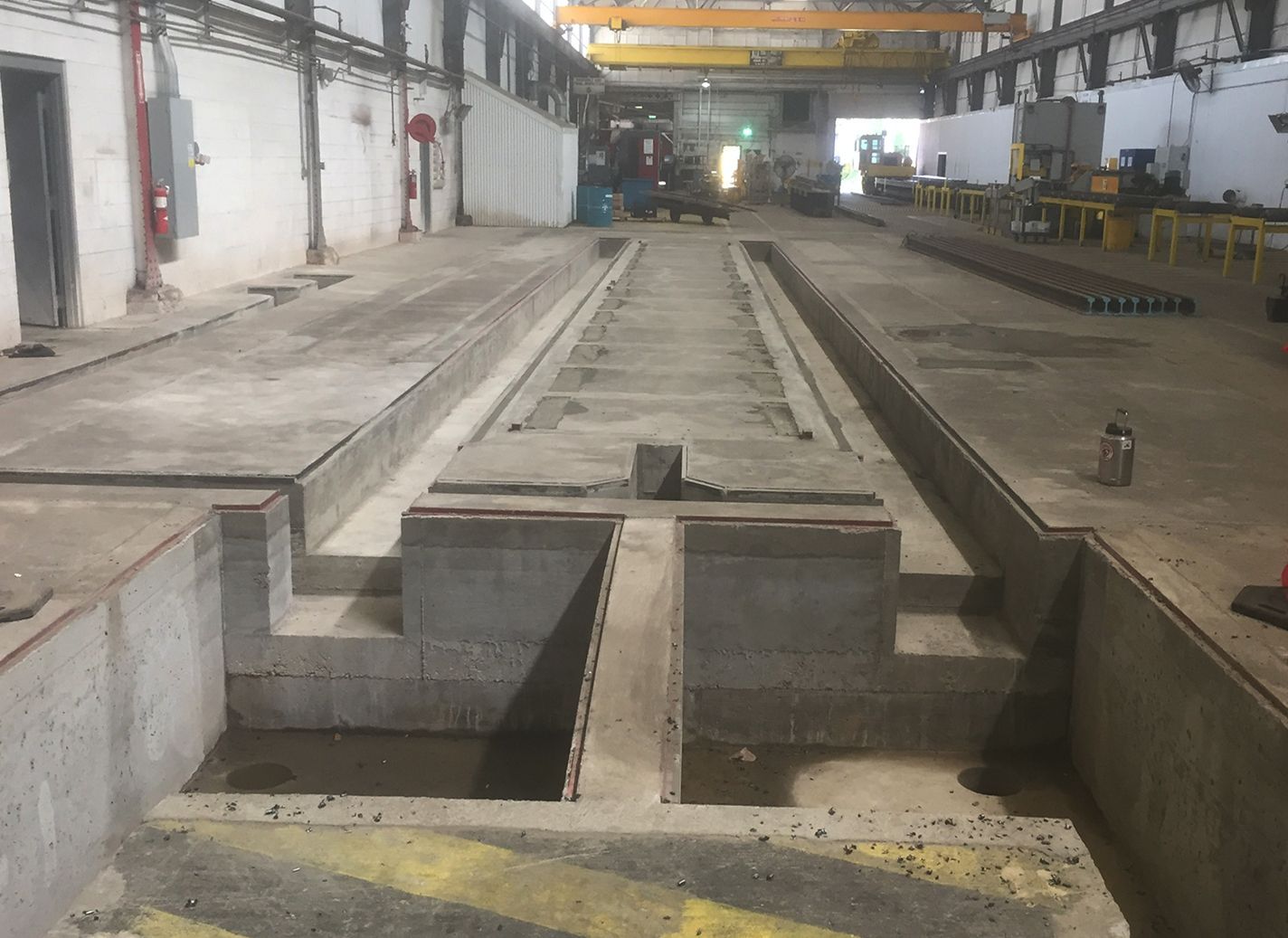 A large warehouse with a lot of machinery in it