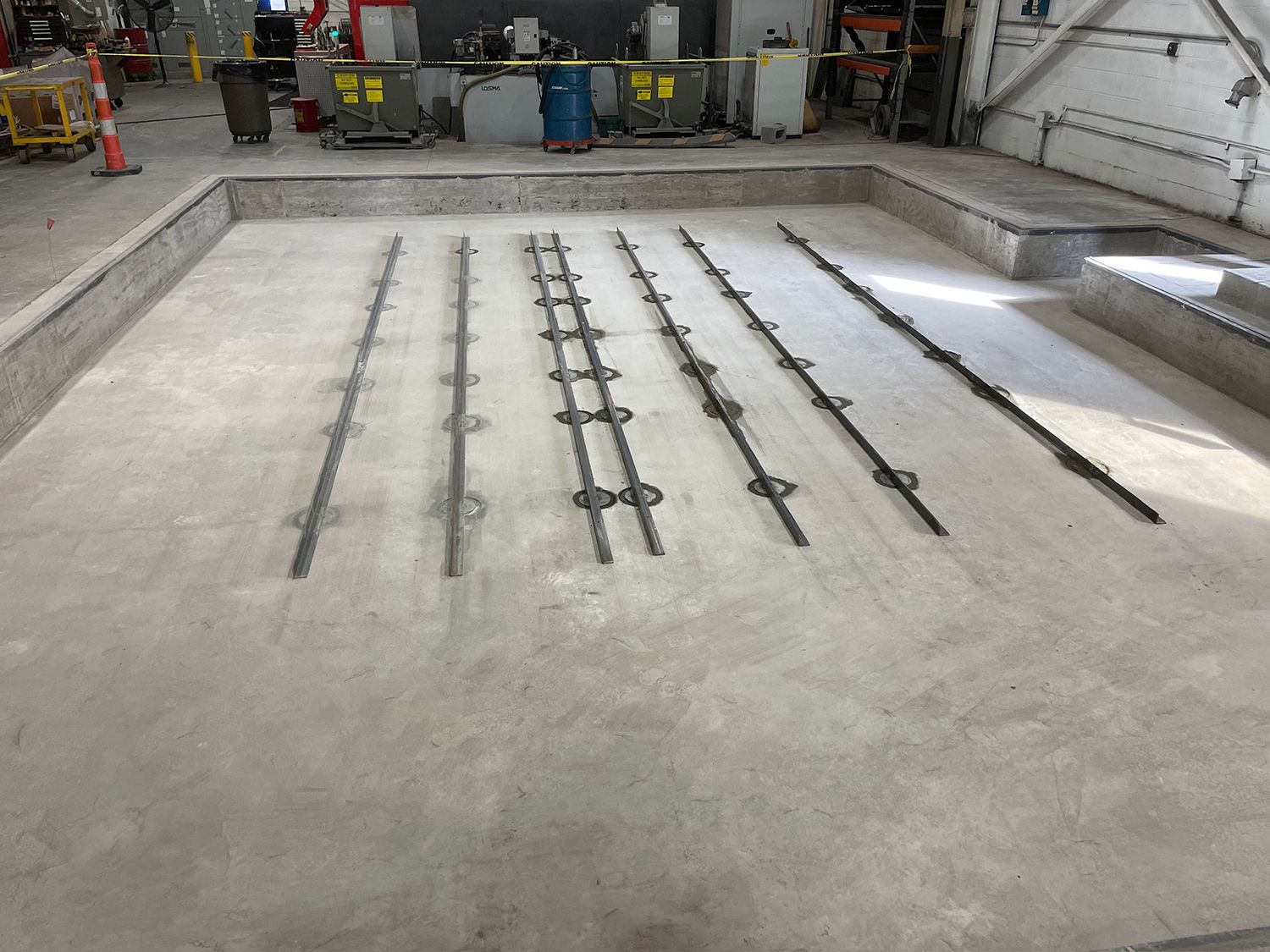 A concrete floor with a lot of lines on it in a building.