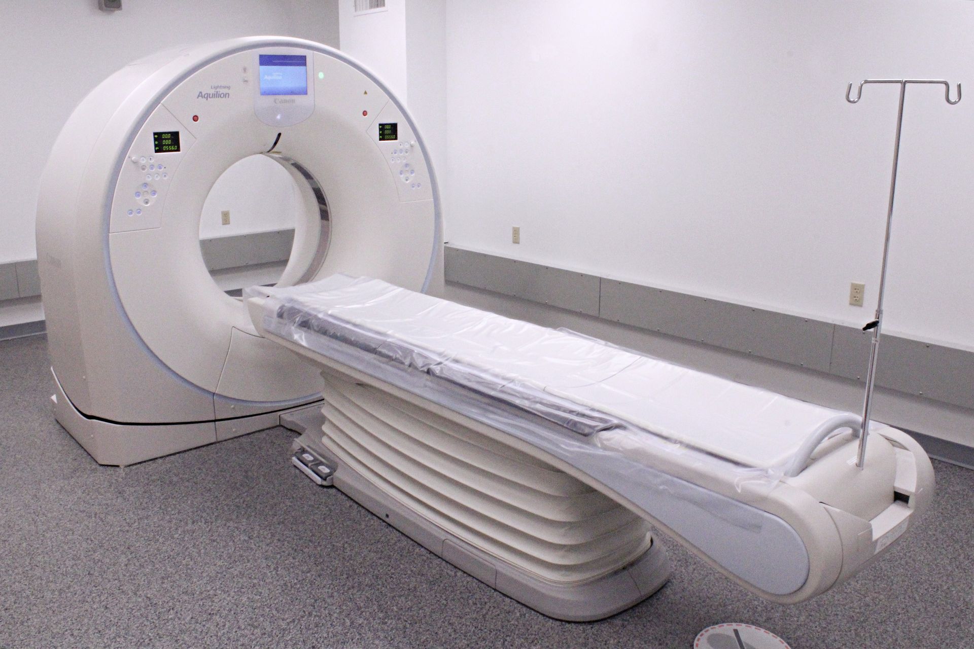 A ct scan machine is sitting in a hospital room