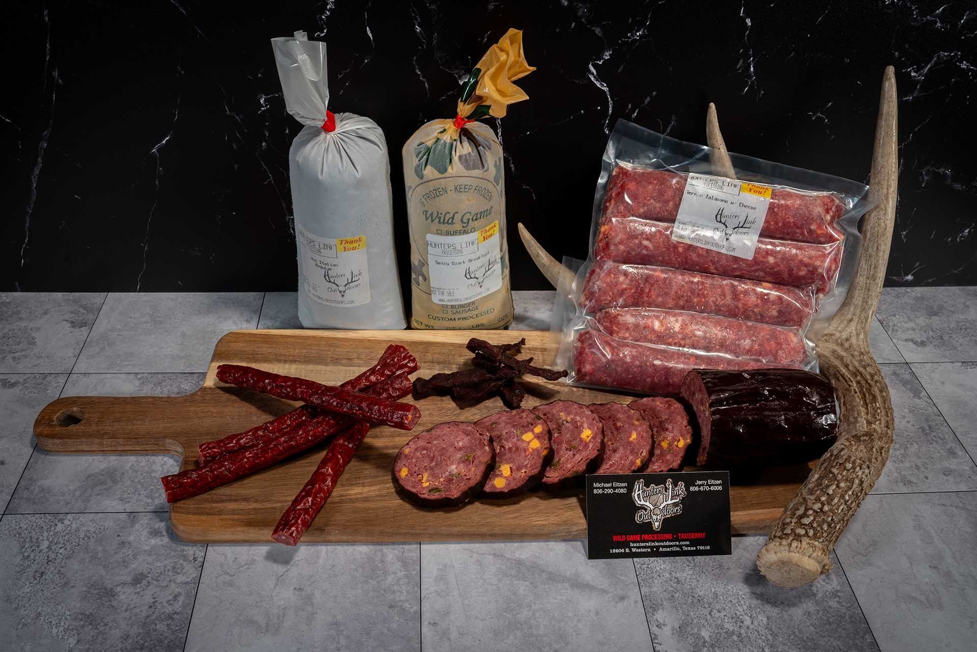 A cutting board with varieties of breakfast sausage