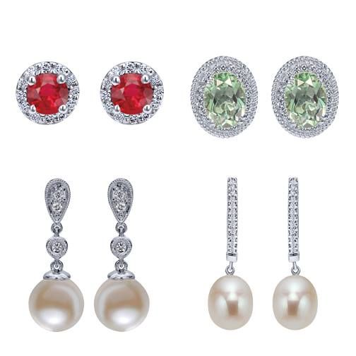 Four pairs of earrings with gemstones and pearls. Red rubies, green gemstones, and white pearls.