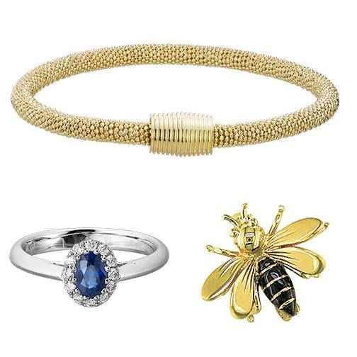 Jewelry set: gold bracelet, sapphire ring, and bee brooch.
