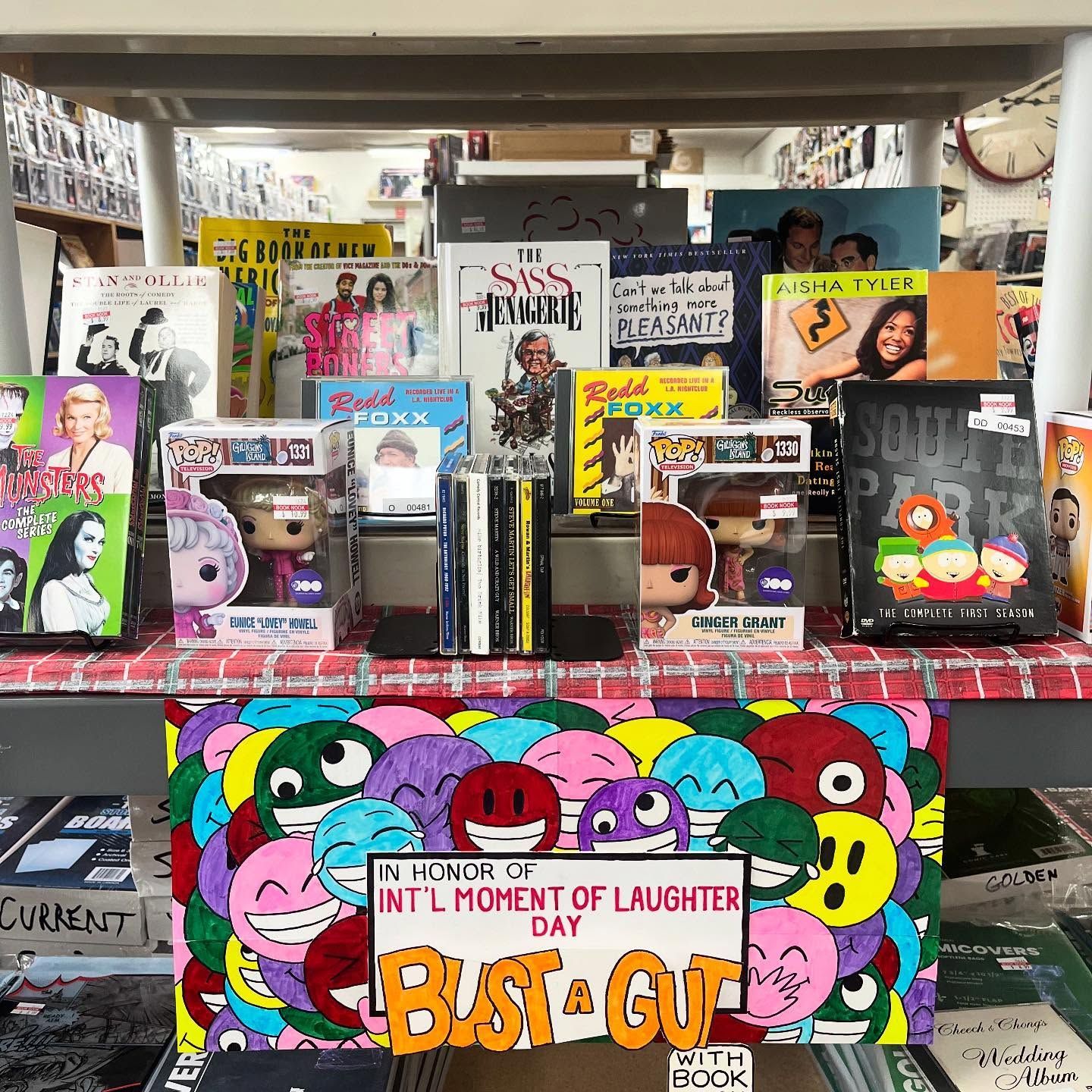 A table with a bunch of books and toys on it.