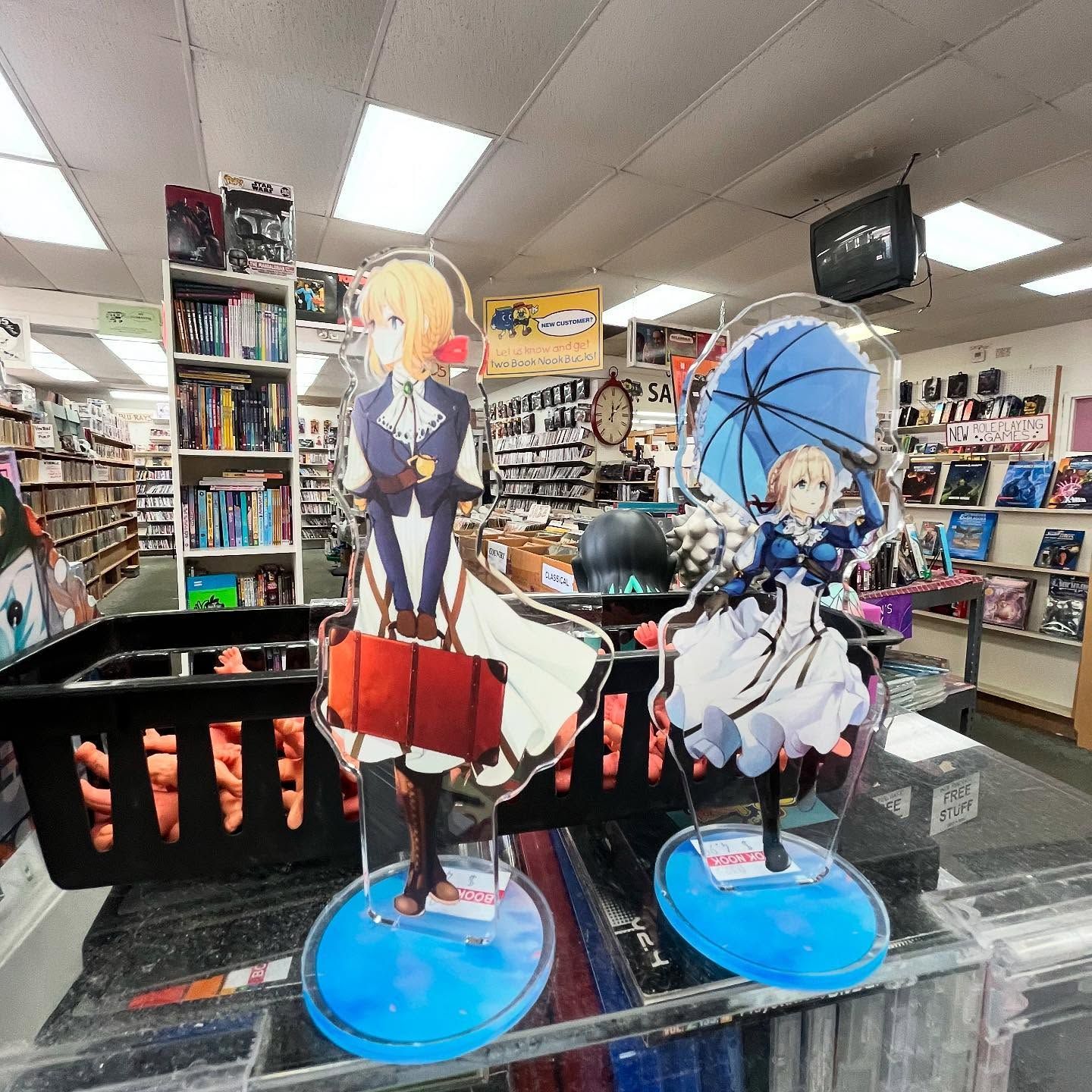 A display of anime figurines in a bookstore