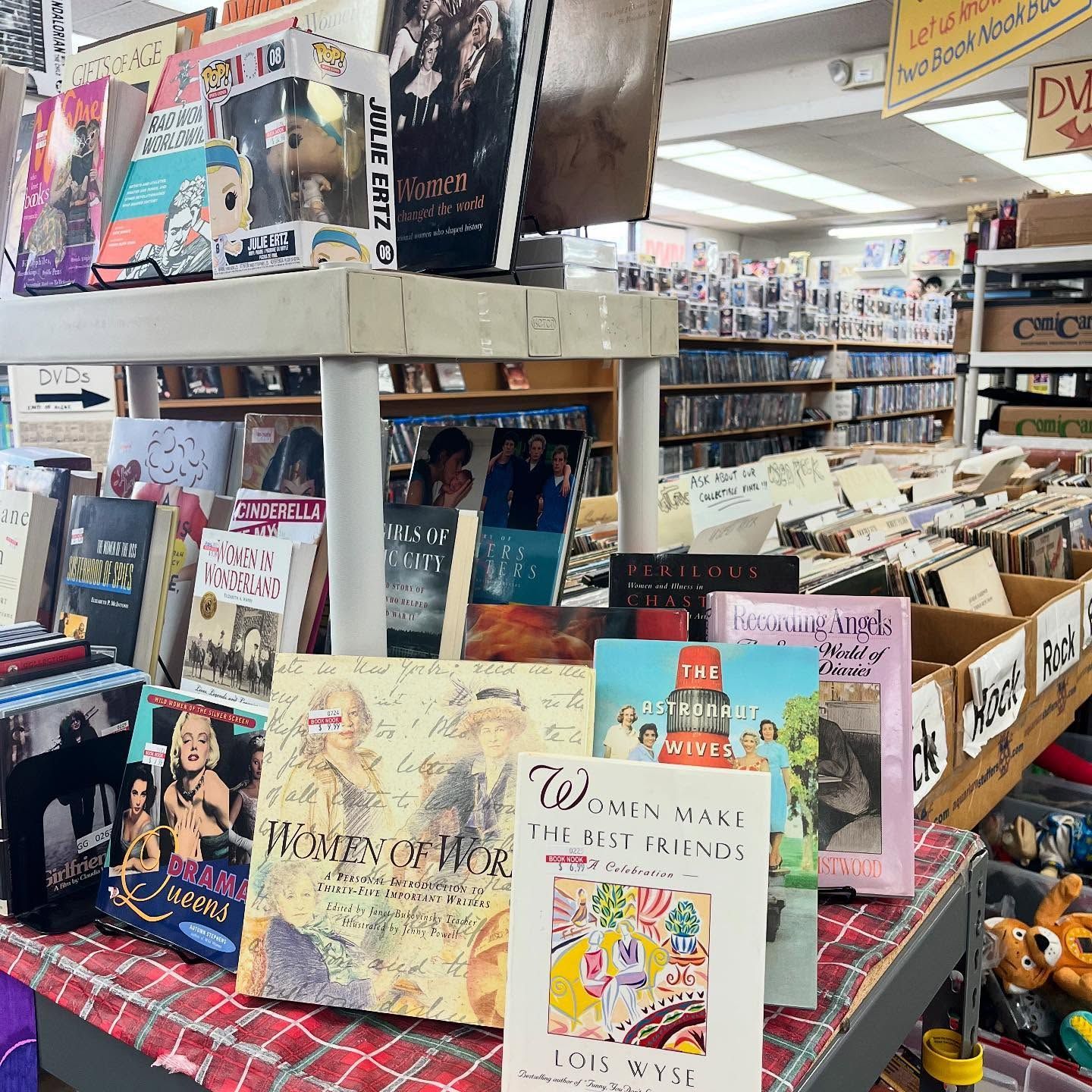 A bunch of books are sitting on a table in a store