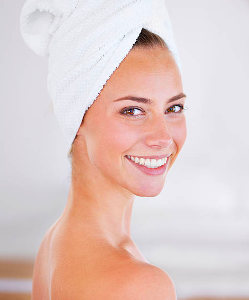 Woman enjoying a spa treatment, glowing skin Woman enjoying a spa treatment, glowing skin