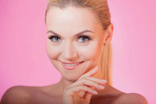 Happy client with radiant skin and stunning lashes at Ooh La Lash and Beauty