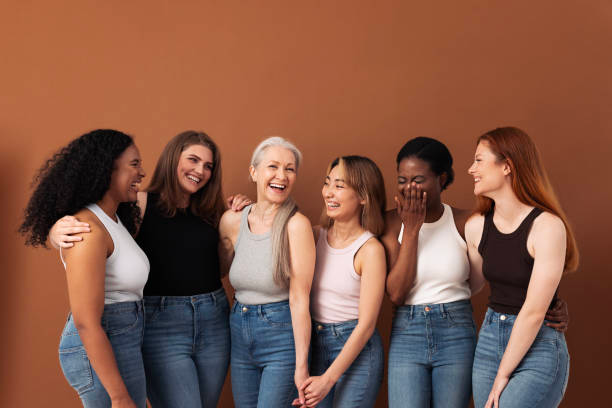 Diverse women with stylish hair in a modern salon, showcasing hair psychology and beauty.
