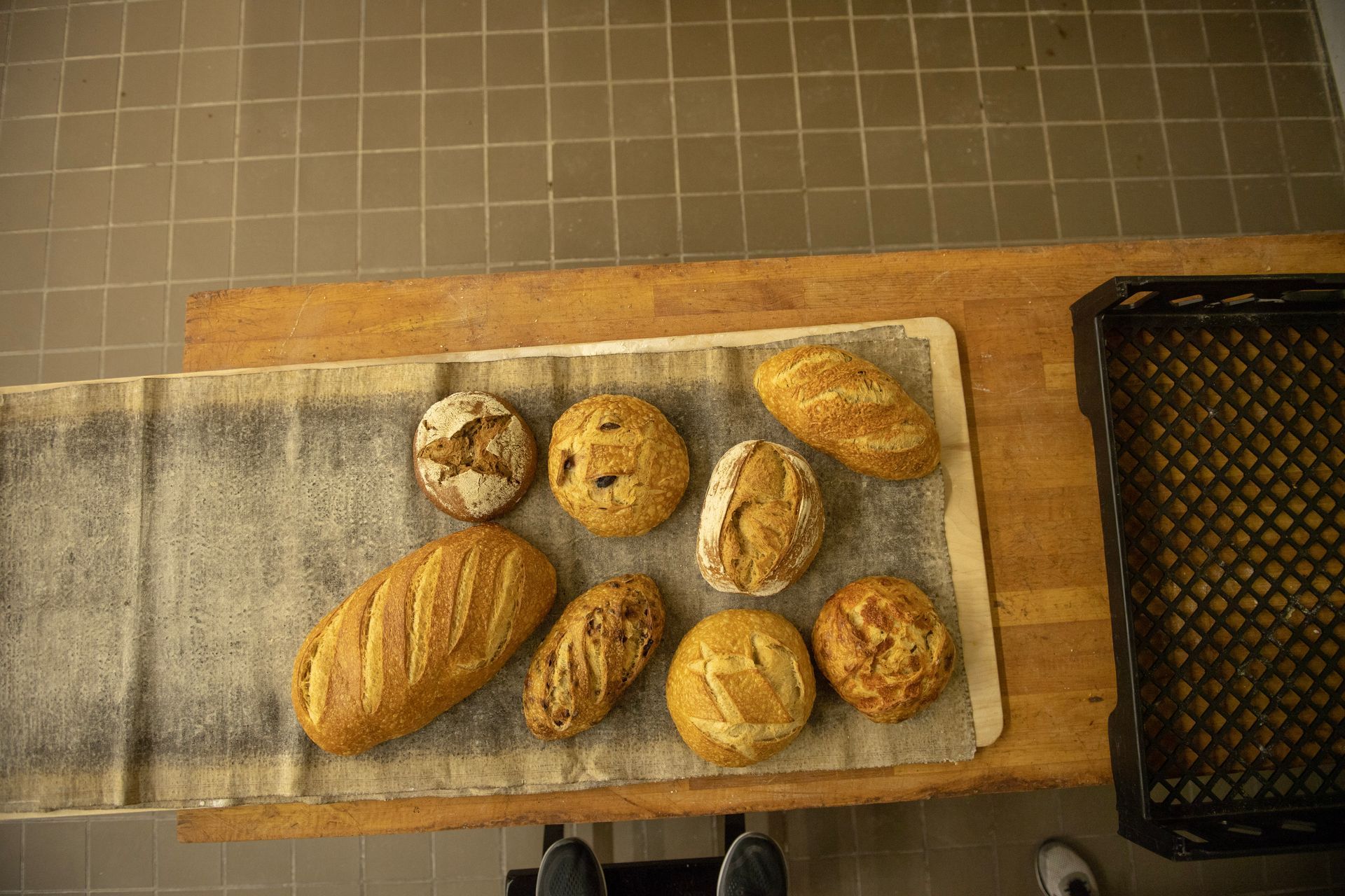 There are many different types of bread on the table.