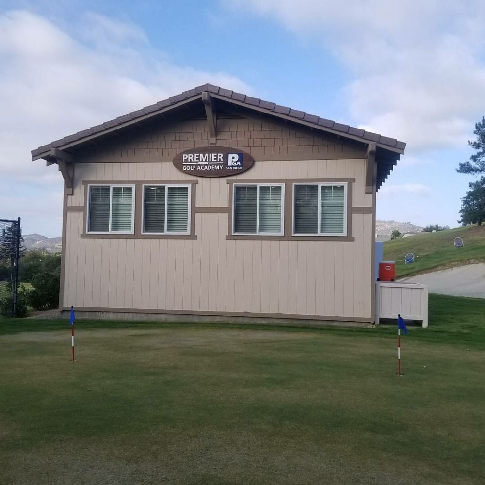 A small tan building with the
