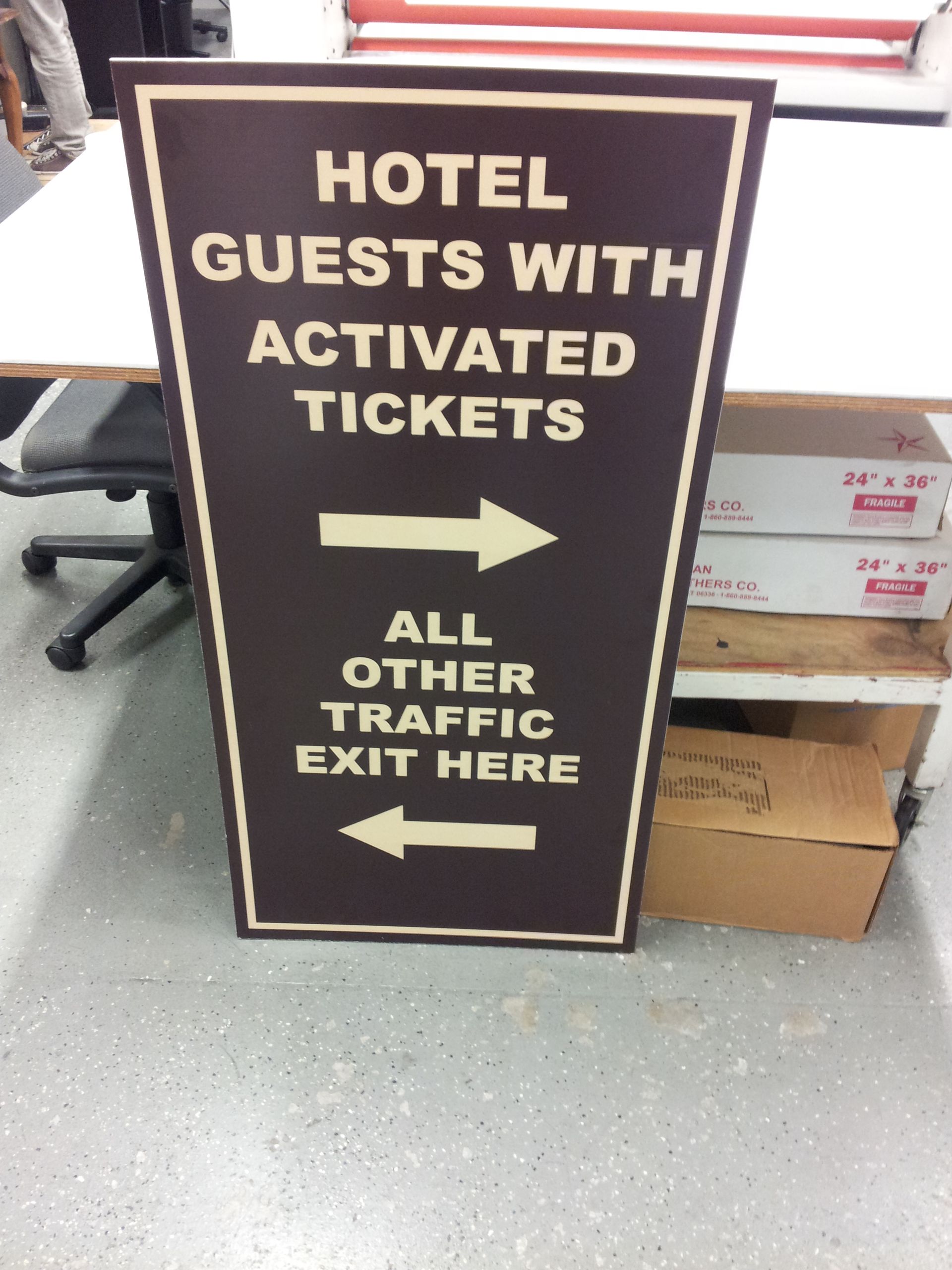 A dark sign with white text reading 