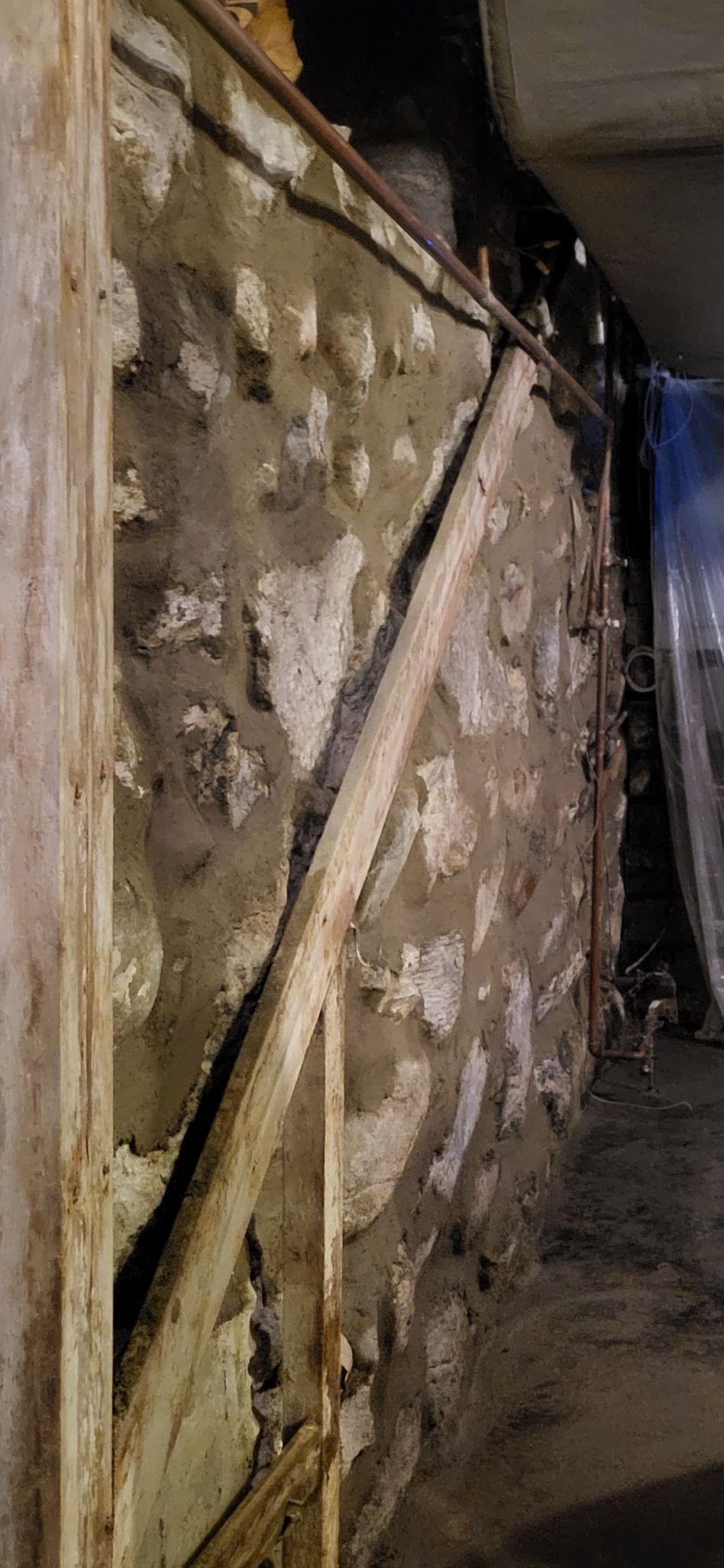 There is a staircase in the wall of a building.