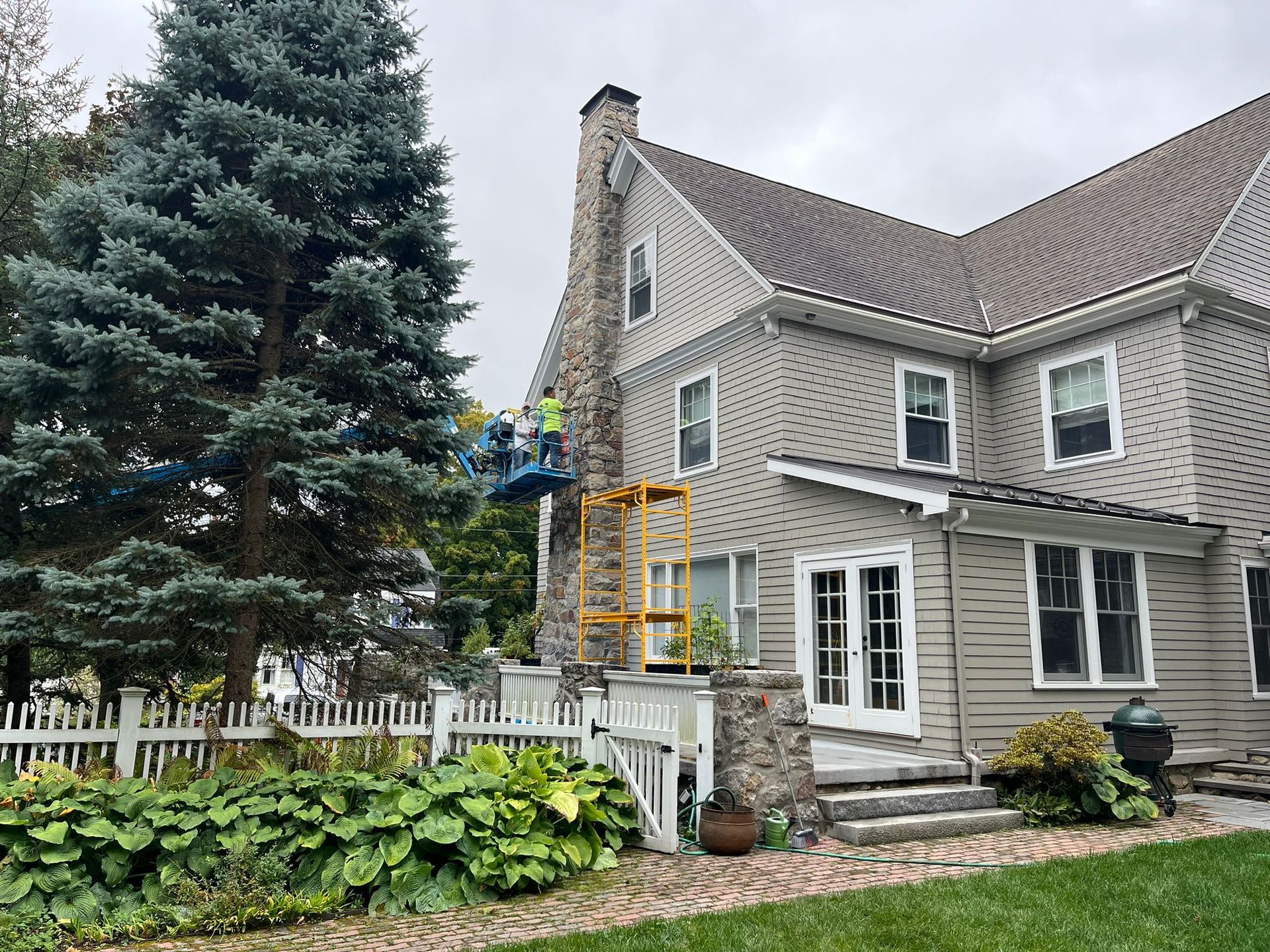 A large house with a large tree in front of it