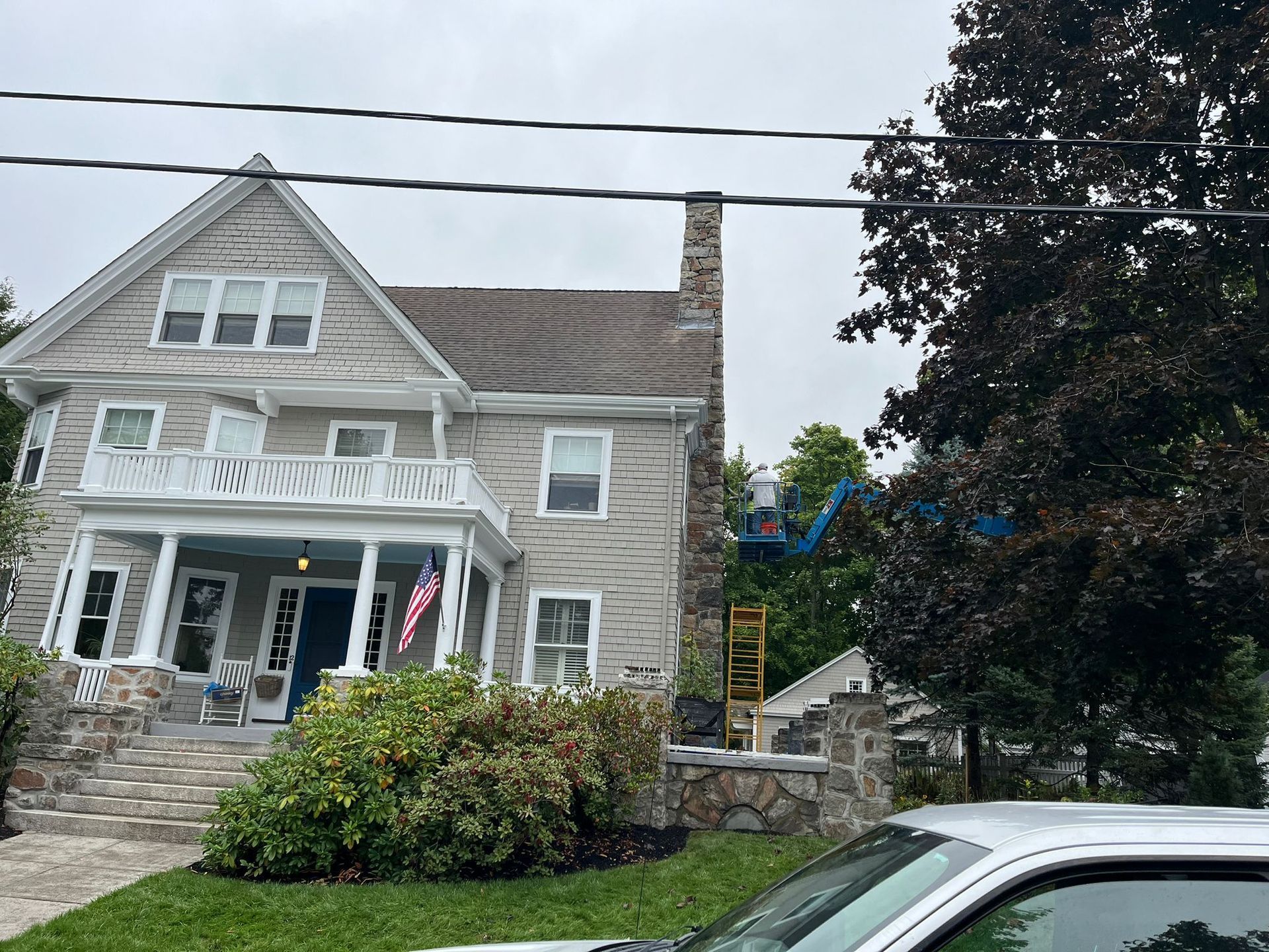 A large house with a car parked in front of it