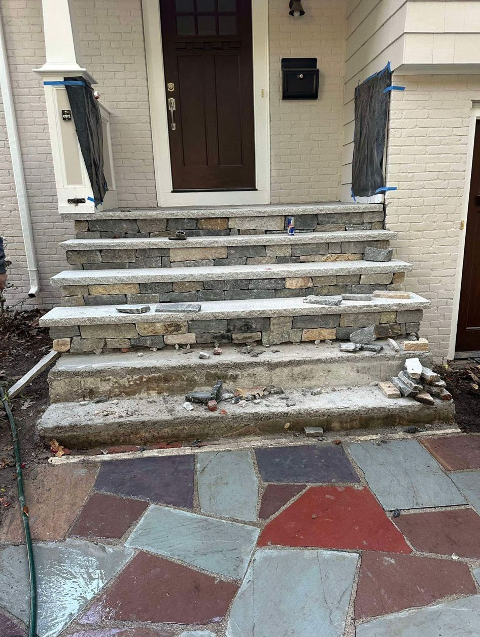 A set of stone stairs leading up to a house
