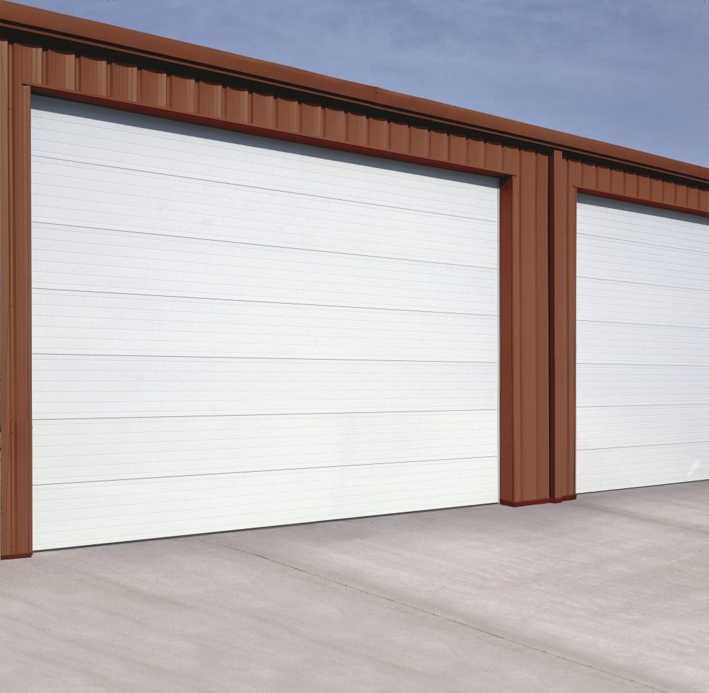 A row of white garage doors with brown trim