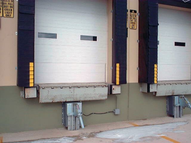 A loading dock with a sign that says ' warehouse ' on it